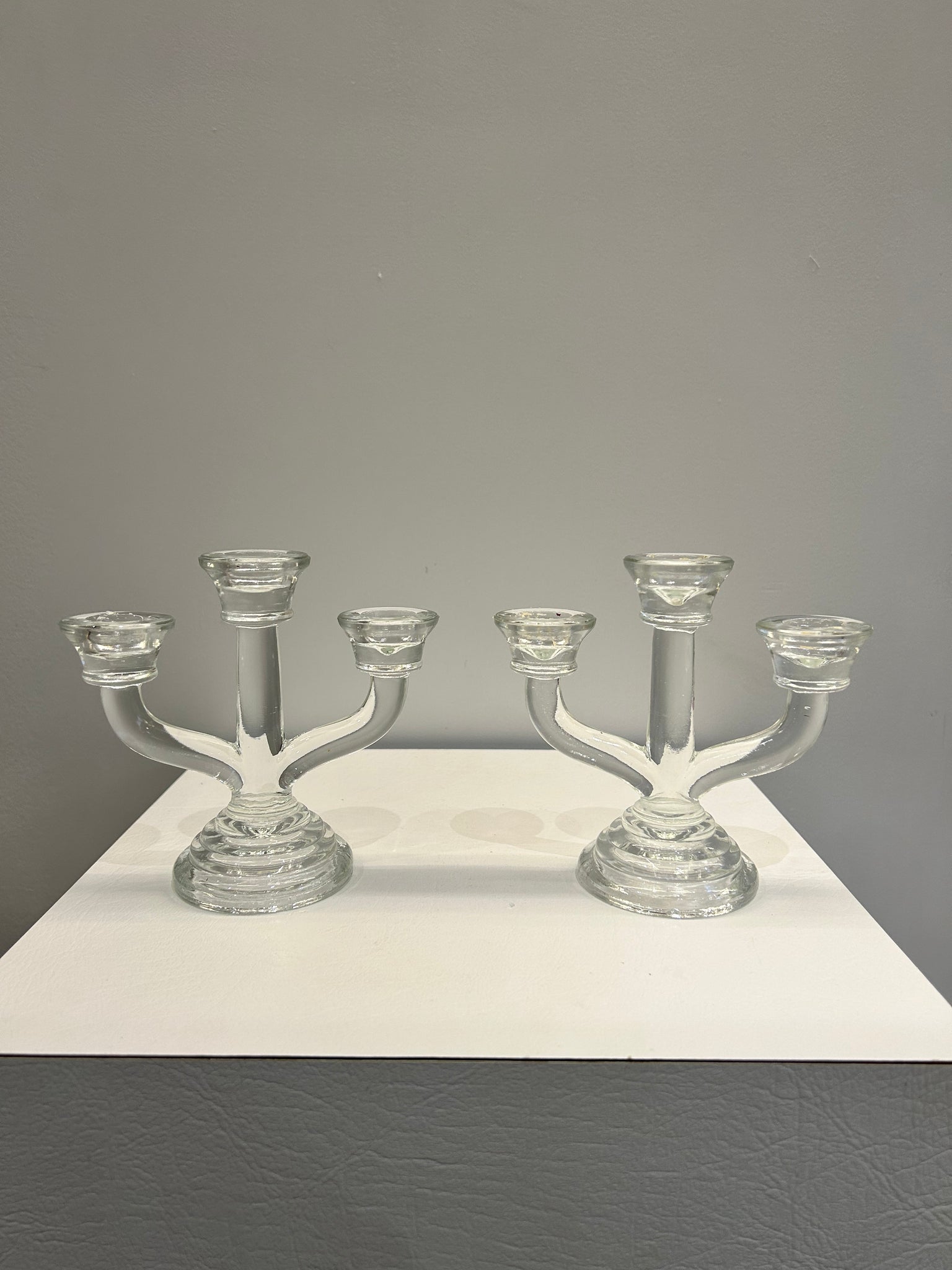 Three headed glass candle holders