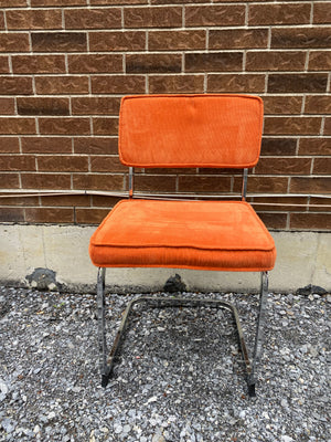 Bright orange velvety & chrome cantilever chairs