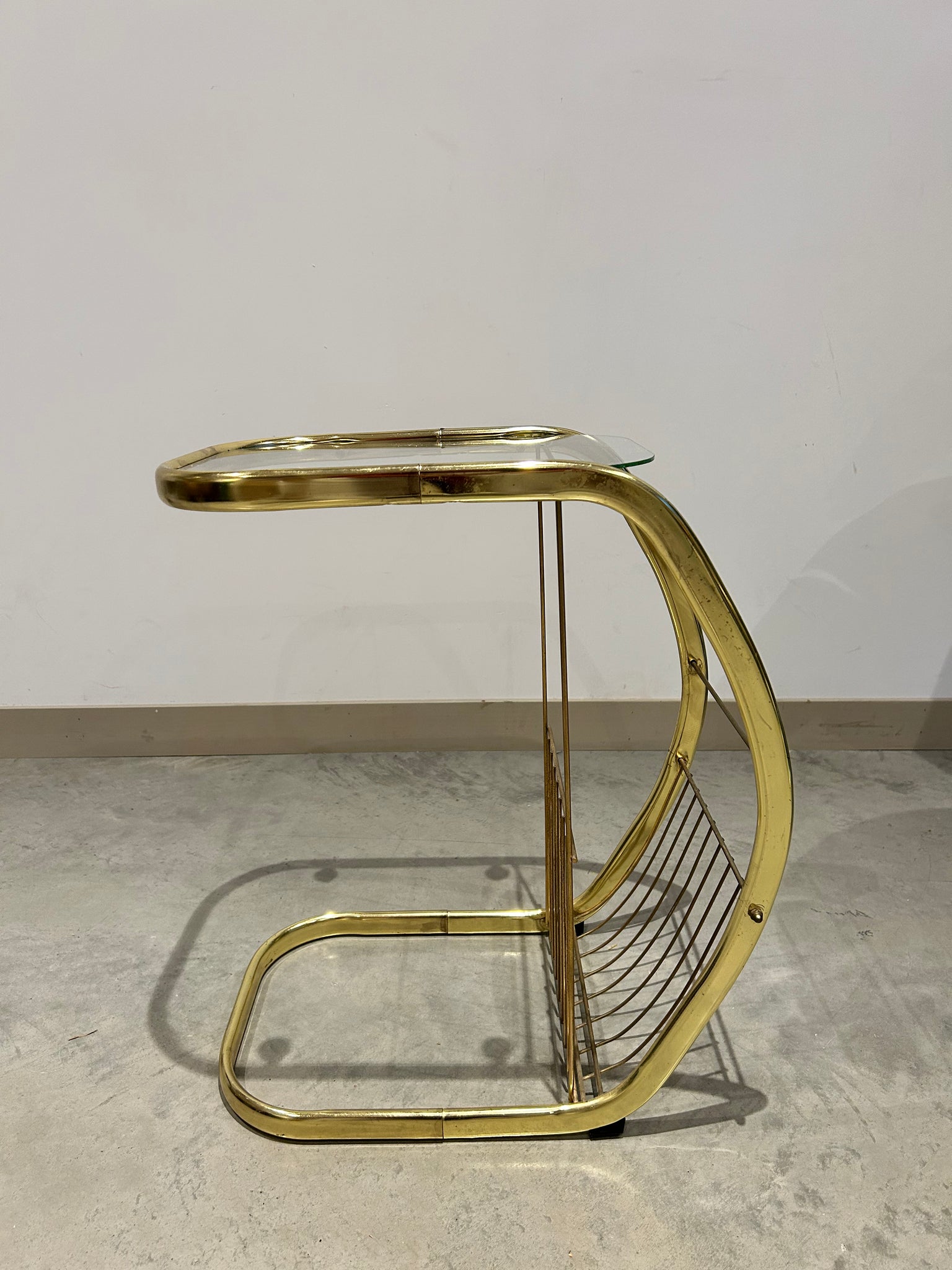 C golden brass side table with literature rack