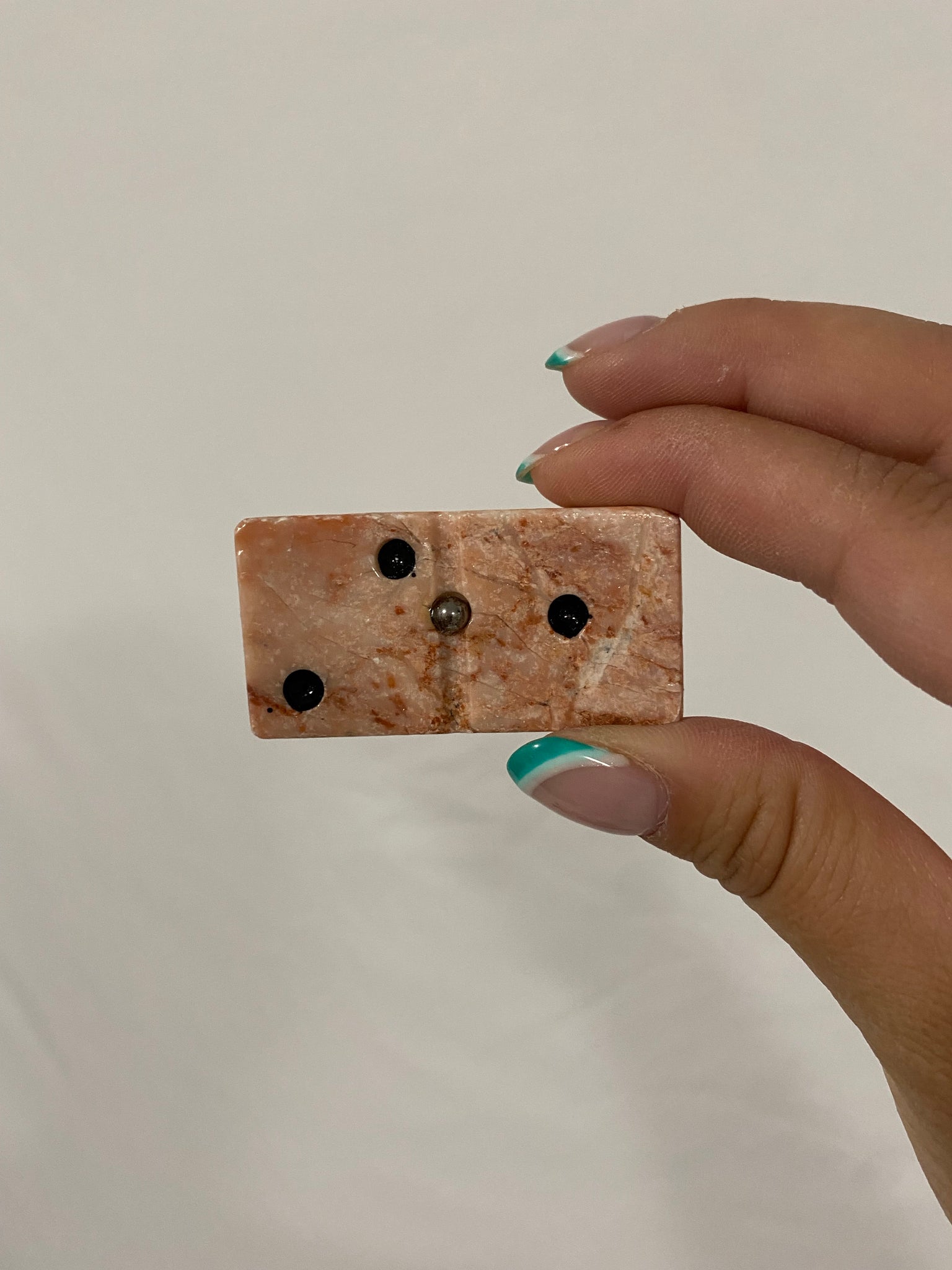 Pink marbled stone dominos game