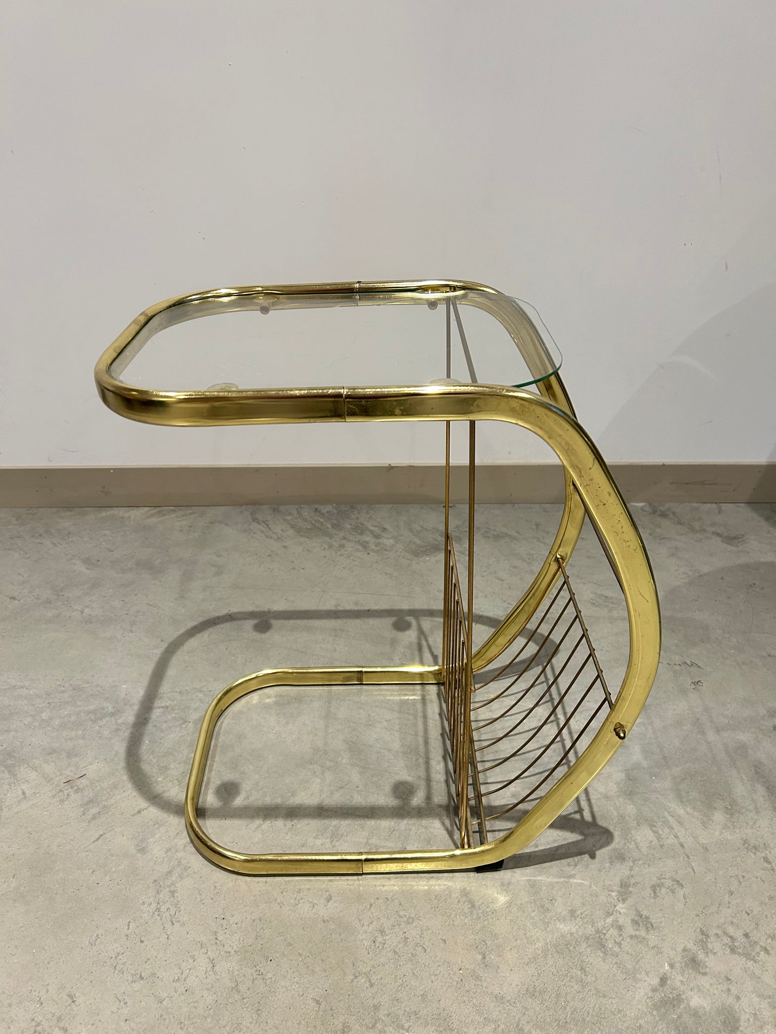 C golden brass side table with literature rack